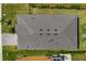 Aerial view showcasing the roof, lush landscaping, a paved driveway, a backyard, and a neighborhood street at 12730 Oak Hill Way, Parrish, FL 34219