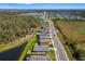 Aerial view of a residential community, featuring well-maintained homes, scenic ponds, and lush greenery at 12730 Oak Hill Way, Parrish, FL 34219