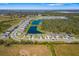 Aerial view of a residential community, featuring well-maintained homes, scenic ponds, and lush greenery at 12730 Oak Hill Way, Parrish, FL 34219