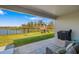 Patio view of backyard with a lake, playground, and outdoor grill at 12730 Oak Hill Way, Parrish, FL 34219
