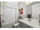 Inviting bathroom features a shower-tub combo, modern fixtures, and a grey vanity at 12730 Oak Hill Way, Parrish, FL 34219