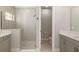 Bright bathroom featuring a glass shower and double vanity sink at 12730 Oak Hill Way, Parrish, FL 34219