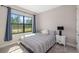 Cozy bedroom with plush carpet, large window, and neutral decor provides a peaceful retreat at 12730 Oak Hill Way, Parrish, FL 34219