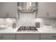 Quartz countertop with stainless steel stove and backsplash at 12730 Oak Hill Way, Parrish, FL 34219