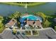 High angle view of the community pool and amenity center next to a peaceful lake at 12730 Oak Hill Way, Parrish, FL 34219