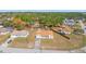Aerial view of a single-Gathering home showcasing its well-maintained lawn and quiet neighborhood setting at 13191 Siam Dr, Spring Hill, FL 34609