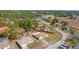 Overhead view of the property and surrounding area, highlighting the large lot and proximity to wooded areas at 13191 Siam Dr, Spring Hill, FL 34609