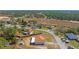 Aerial view of a home, located on a spacious lot in a serene, wooded neighborhood at 13191 Siam Dr, Spring Hill, FL 34609