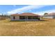 Expansive backyard featuring a screened-in porch, offering a private outdoor living space at 13191 Siam Dr, Spring Hill, FL 34609