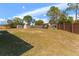 Expansive backyard featuring a storage shed and ample space for recreation and gardening at 13191 Siam Dr, Spring Hill, FL 34609