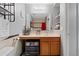 Bathroom featuring a vanity with a sink, a large mirror, and ample storage space at 13191 Siam Dr, Spring Hill, FL 34609