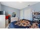 Another view of bedroom featuring a stylish dresser and closet space to create a cozy atmosphere at 13191 Siam Dr, Spring Hill, FL 34609