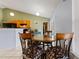 Cozy dining area featuring a round table with stylish chairs and pendant lighting at 13191 Siam Dr, Spring Hill, FL 34609
