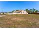 Charming single-story home featuring a well-maintained lawn and attached two-car garage at 13191 Siam Dr, Spring Hill, FL 34609