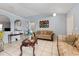 Bright living room showcasing tile floors, arched doorways and elegant furniture at 13191 Siam Dr, Spring Hill, FL 34609