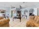 Bright living room showcasing tile floors, arched doorways and elegant furniture at 13191 Siam Dr, Spring Hill, FL 34609