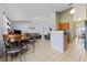Open concept living and dining area with seamless flow and lots of natural light at 13191 Siam Dr, Spring Hill, FL 34609