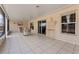 Enclosed patio with tile floor is perfect for outdoor entertaining and relaxing at 13191 Siam Dr, Spring Hill, FL 34609