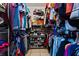 Walk-in closet designed with ample shelving and rod space for clothing and shoe storage at 13191 Siam Dr, Spring Hill, FL 34609