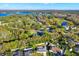 An aerial shot of the property with lush foliage and several bodies of water surrounding the homes at 13911 Briardale Ln, Tampa, FL 33618
