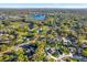 An aerial shot of a lake community with pools and mature trees at 13911 Briardale Ln, Tampa, FL 33618