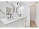 Bathroom featuring dual sinks with modern fixtures, quartz countertop and modern lighting at 13911 Briardale Ln, Tampa, FL 33618