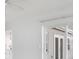 Open living room with views of the backyard through the sliding glass doors and kitchen access at 13911 Briardale Ln, Tampa, FL 33618