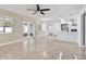 Spacious open floor plan featuring tile flooring, an eat-in kitchen, and sliding glass doors to the backyard at 13911 Briardale Ln, Tampa, FL 33618