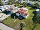 An aerial view of a cozy one-story house featuring a spacious yard and charming curb appeal at 15822 Redington Dr, Redington Beach, FL 33708
