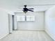 Bright and spacious bedroom with a ceiling fan and closet at 1620 58Th Ave. S. # 1, St Petersburg, FL 33712