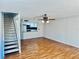 Inviting living room with wood floors, adjacent to a modern kitchen with bar seating at 1620 58Th Ave. S. # 1, St Petersburg, FL 33712