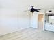 Bright bedroom with ceiling fan and adjoining bathroom at 1620 58Th Ave. S. # 1, St Petersburg, FL 33712