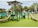 A fun and safe playground area for children, featuring slides and climbing structures with shaded seating at 1620 58Th Ave. S. # 1, St Petersburg, FL 33712
