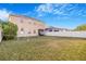 Spacious backyard featuring a large lawn, privacy fence, and a soccer goal at 20427 Carolina Cherry Ct, Tampa, FL 33647