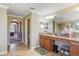 Spacious bathroom with dual vanities, granite counters, and access to the water closet at 20427 Carolina Cherry Ct, Tampa, FL 33647