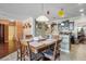 Open-concept dining area with seating for six, seamlessly connecting to the kitchen and other living spaces at 20427 Carolina Cherry Ct, Tampa, FL 33647