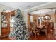 Festive dining room with Christmas tree, hardwood floors, and traditional decor at 20427 Carolina Cherry Ct, Tampa, FL 33647