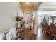 Inviting entryway with hardwood floors leading to a formal dining room and Christmas tree at 20427 Carolina Cherry Ct, Tampa, FL 33647