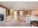 Bright hallway with wainscotting, tan walls, and white trim leading to various rooms at 20427 Carolina Cherry Ct, Tampa, FL 33647