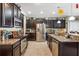 Modern kitchen featuring stainless steel appliances, granite countertops, and ample cabinet space for storage at 20427 Carolina Cherry Ct, Tampa, FL 33647