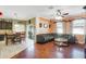 Open-concept living area with beautiful hardwood floors, neutral paint, and lots of natural light at 20427 Carolina Cherry Ct, Tampa, FL 33647