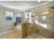 Modern bathroom with a glass-enclosed shower, soaking tub, and tiled accents at 20427 Carolina Cherry Ct, Tampa, FL 33647