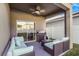 Inviting covered patio with comfortable seating and a barbecue grill for outdoor entertaining at 20427 Carolina Cherry Ct, Tampa, FL 33647