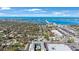 A captivating aerial view showcases a coastal condo with a private pool against the backdrop of a scenic bay and skyline at 215 Valencia Blvd # 205, Belleair Bluffs, FL 33770