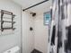 This bathroom features a modern shower with black fixtures and contrasting white tile at 215 Valencia Blvd # 205, Belleair Bluffs, FL 33770