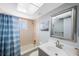 The bathroom features a tub, shower, sleek vanity, and great lighting at 215 Valencia Blvd # 205, Belleair Bluffs, FL 33770