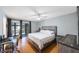 A serene bedroom with a comfortable bed and private balcony access at 215 Valencia Blvd # 205, Belleair Bluffs, FL 33770