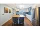 Bright kitchen with stainless steel appliances, an island with seating, and modern lighting at 215 Valencia Blvd # 205, Belleair Bluffs, FL 33770