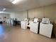 Clean and well-maintained community laundry room with multiple washers and dryers at 215 Valencia Blvd # 205, Belleair Bluffs, FL 33770