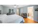 This main bedroom is spacious, with a ceiling fan, a desk, and an ensuite bathroom at 215 Valencia Blvd # 205, Belleair Bluffs, FL 33770